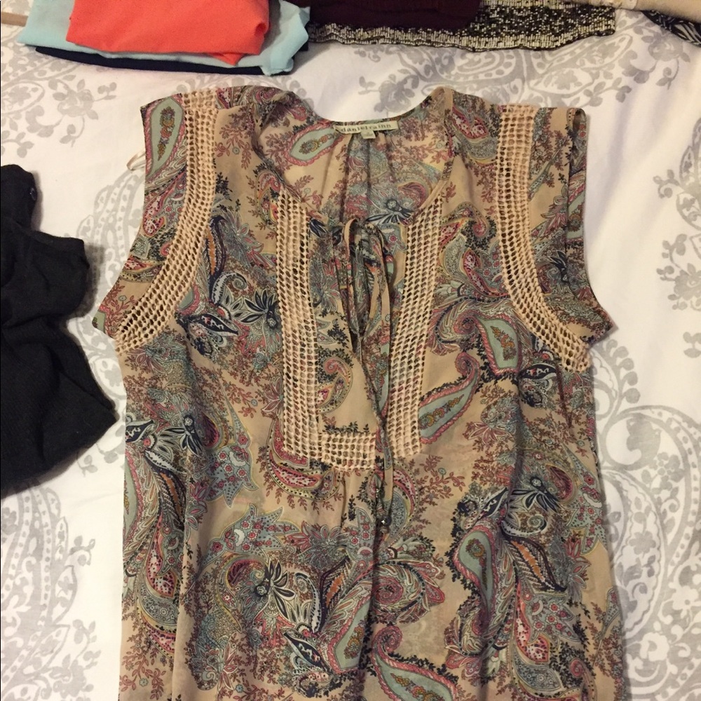 Sheer flowing sleeveless blouse